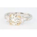 An 18ct 2 colour gold diamond ring, the centre brilliant cut stone approx 1.57ct, colour L,