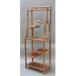 A bamboo 7 tier whatnot 72"h x 25 1/2"w x 14"d 6 terminals to the ends of the uprights are