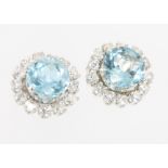 A pair of 18ct white gold aquamarine and diamond ear studs