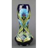 A contemporary Moorcroft waisted oviform vase, the blue ground with stylised flowers no.198/300 11",
