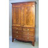 A Victorian mahogany linen press, the upper section with moulded and dentil cornice, fitted 5