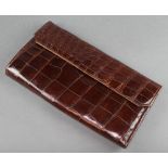 A lady's brown crocodile clutch bag 7" x 11"