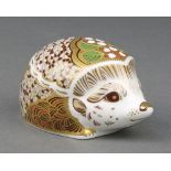 A Royal Crown Derby Imari pattern paperweight in the form of a hedgehog with gold stopper 3 3/4"