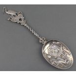 A Dutch silver spoon with heron finial, twist stem and Inn scene 8.25", 60 grams