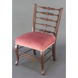 An Edwardian inlaid mahogany London ladderback bedroom seat with upholstered seat raised on cabriole