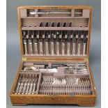 An oak canteen containing a quantity of plated Mappin & Webb tableware for 6