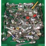 A collection of plated souvenir spoons