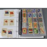 An album containing 54 Kensitas silks of flags and 280 matchbox covers