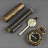 A First World War prismatic compass the base marked F-L no. 196892 1917, a brass "cannon" shell, a