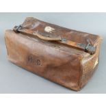 Pew & Company, a leather Gladstone bag with 5 Southern Railways labels (some damage) containing 3