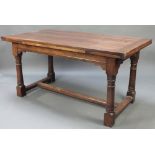 A 17th/18th Century style oak dining suite comprising rectangular draw leaf table of plank