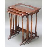 A nest of 3 Edwardian rectangular mahogany interfitting coffee tables raised on turned supports, the