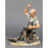 A Capodimonte figure of a cobbler, signed Volta 8"