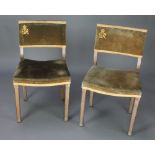 Maple & Co, a pair of George VI limed oak Coronation chairs The upholstery on both chairs is