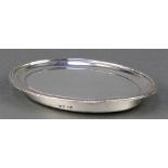 A George III oval silver kettle stand with wooden base London 1802, 6"