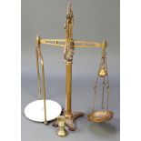 A pair of 19th Century W & T Avery brass and iron scales together with a 4lb bell weight