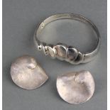 A stylish Continental silver bangle and a pair of ditto shell shaped earrings 61 grams