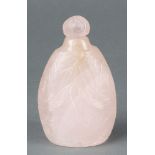 A 19th/20th Century Chinese carved rose quartz globular flattened scent bottle with stopper,