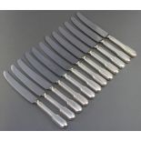 A set of 12 silver handled dinner knives