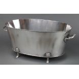 A plated 2 handled champagne cooler on paw feet 19"