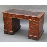 A Victorian mahogany desk with brown writing surface above 1 long and 8 short drawers 28"h x 47"w