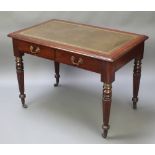 A Victorian style mahogany writing table with inset writing surface, the base fitted 2 short