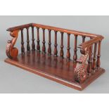 A rectangular Regency style mahogany book rack with bobbin turned decoration 7" x 17" x 8"