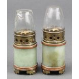 A pair of Chinese cylindrical jade miniature opium lamps with bronze and gilt metal mounts and glass