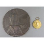 A Victory medal and Death plaque to 15047 Private William Fitzpatrick Royal Lancashire Regt.