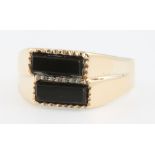 A 9ct yellow gold onyx set ring size K