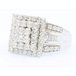 A 14ct yellow gold dress ring set with brilliant and baguette cut diamonds approx 2.7ct, size P