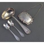 A Victorian silver spoon Sheffield 1896, 2 mustard spoons and a repousse spirit label 58 grams