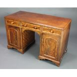 A Victorian mahogany kneehole pedestal dressing table fitted 3 short drawers with tore handles,