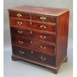 A Georgian mahogany chest with crossbanded top above 2 short and 4 long drawers, raised on bracket