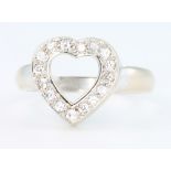 An 18ct white gold heart shaped paste set ring, size T