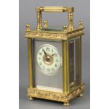 A 19th Century French 8 day carriage timepiece with circular enamelled dial and Arabic numerals