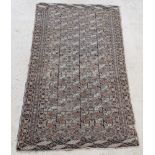 A sand ground Tekke Torkman rug with 36 octagons to the centre within multi-row border 84" x 44"