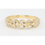An 18ct yellow gold diamond set heart shaped ring size N 1/2