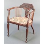 A Victorian carved walnut tub back chair with stick decoration and upholstered seat, raised on