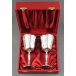 A pair of silver goblets with chased scroll decoration,Charles S Green and Co, Birmingham 1968,