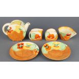 A Clarice Cliff Bizarre Nasturtium part tea set comprising teapot and lid, cream jug, sugar bowl,