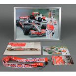 Lewis Hamilton, a signed colour photograph 8" x 11", a signed postcard 4" x 6" together with a piece