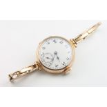 A lady's 9ct yellow gold wristwatch on a ditto expanding bracelet