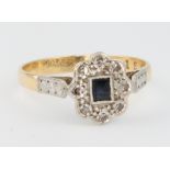 An 18ct yellow gold diamond and sapphire ring, size N