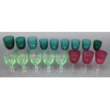 9 Victorian green glass matched wines, 3 ditto cranberry and 5 other glasses