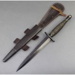 A Fairbairn Sykes fighting dagger with 7" blade, the pommel marked FR69 IFR69, the frog marked