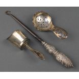 A Georgian design pierced silver sifter spoon, Sheffield 1944, a button hook and a silver sugar