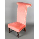 A Victorian prie-dieu chair upholstered in pink dralonFrame is slightly loose