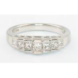 A platinum 7 stone diamond princess cut stepped mount ring size L 1/2