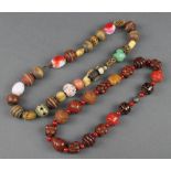 A Chinese glass horn and hardstone bead necklace, a Japanese ditto with carved mask beads and hard